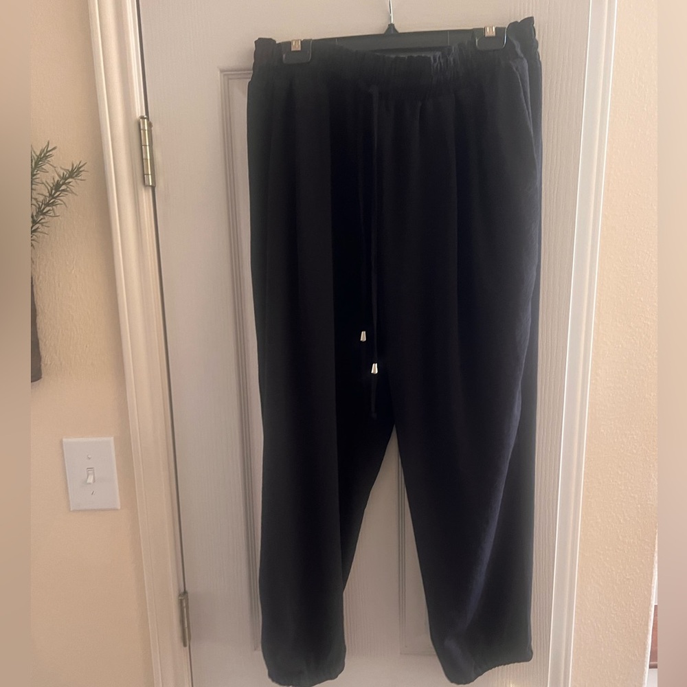 Black crinkle materiel pants. XL with stretchy cuff at the ankle.